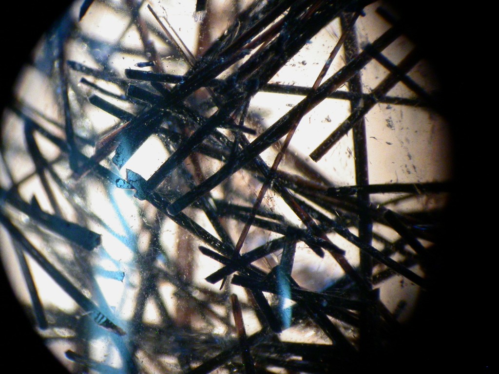 Quartz rock crystal with orangish brown needle inclusions 2